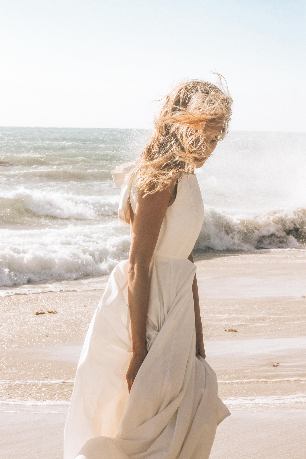 Woman Wearing a White Dress at the Beach